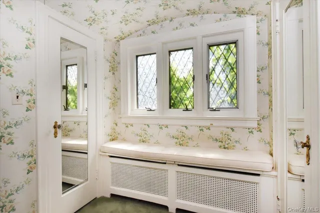 a bathroom with a sink and a window