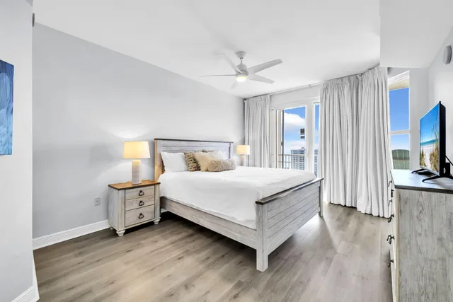 a bedroom with a bed and a tv