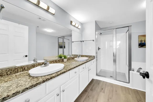 a bathroom with a tub and shower