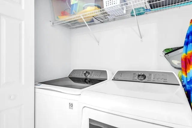 a bedroom with a large bed and a large window