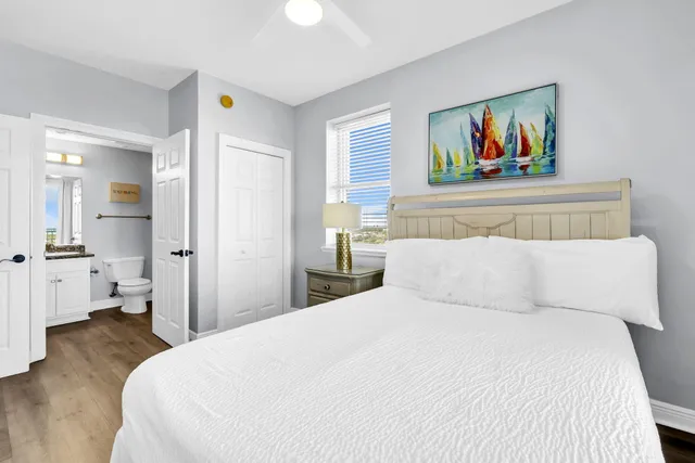 a bathroom with a granite countertop sink toilet a mirror and shower