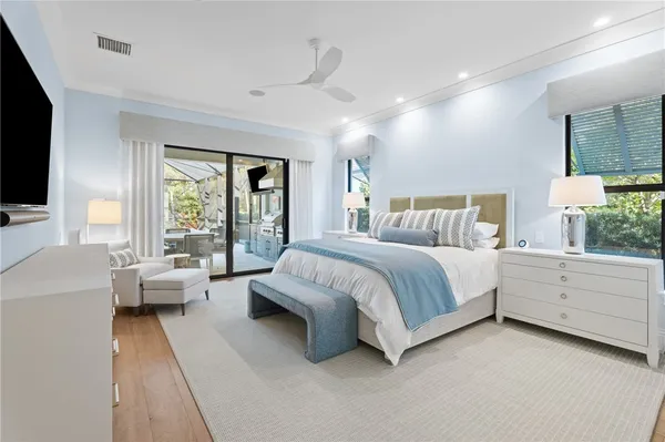 a spacious bedroom with a bed and a large window