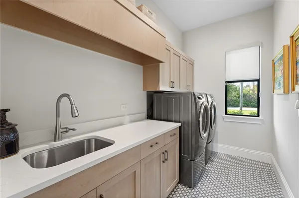 a kitchen with a refrigerator and a sink