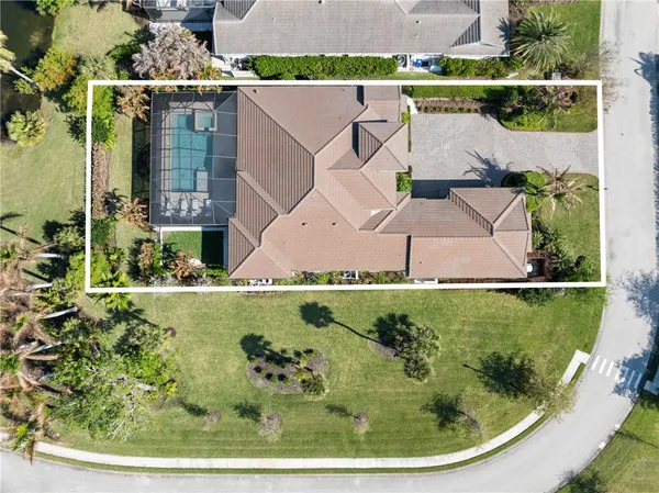an aerial view of a house with outdoor space swimming pool and outdoor seating