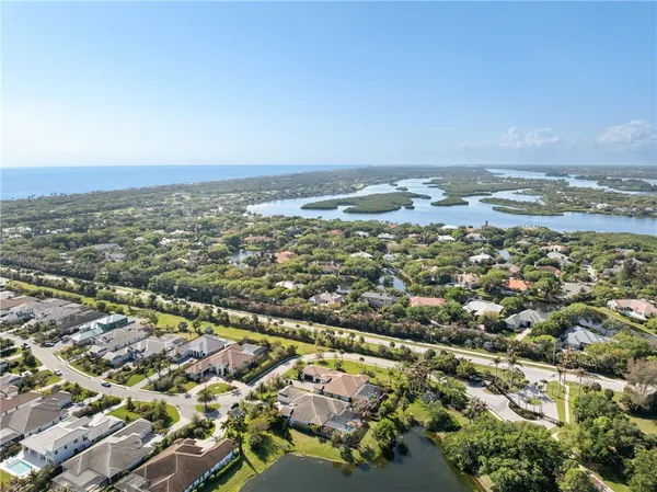 an aerial view of residential building and lake