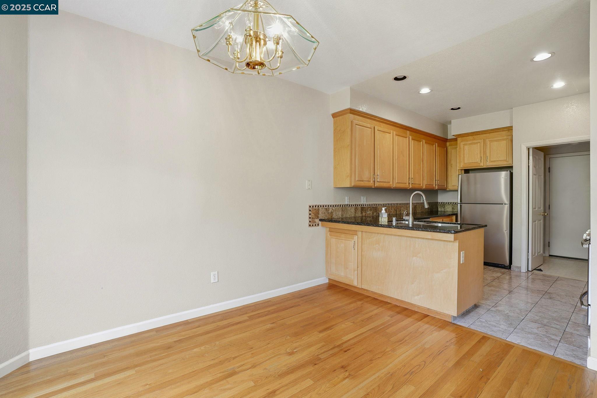 1295 Shell Circle Clayton, CA 94517 - Photo 14 of 36 a kitchen with a refrigerator and a stove top oven