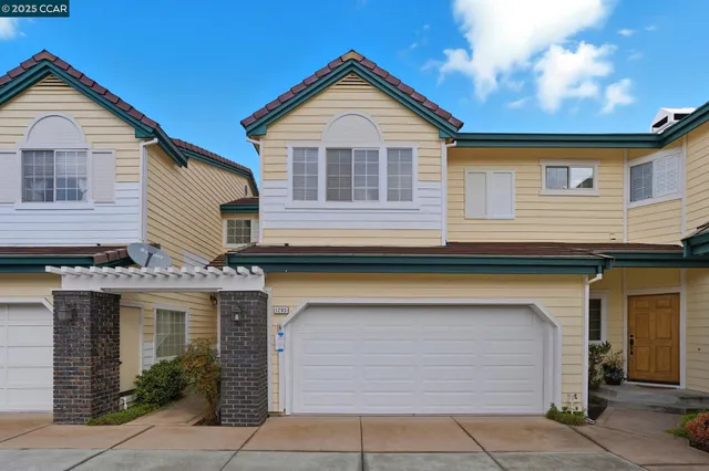 a front view of a house with a garage