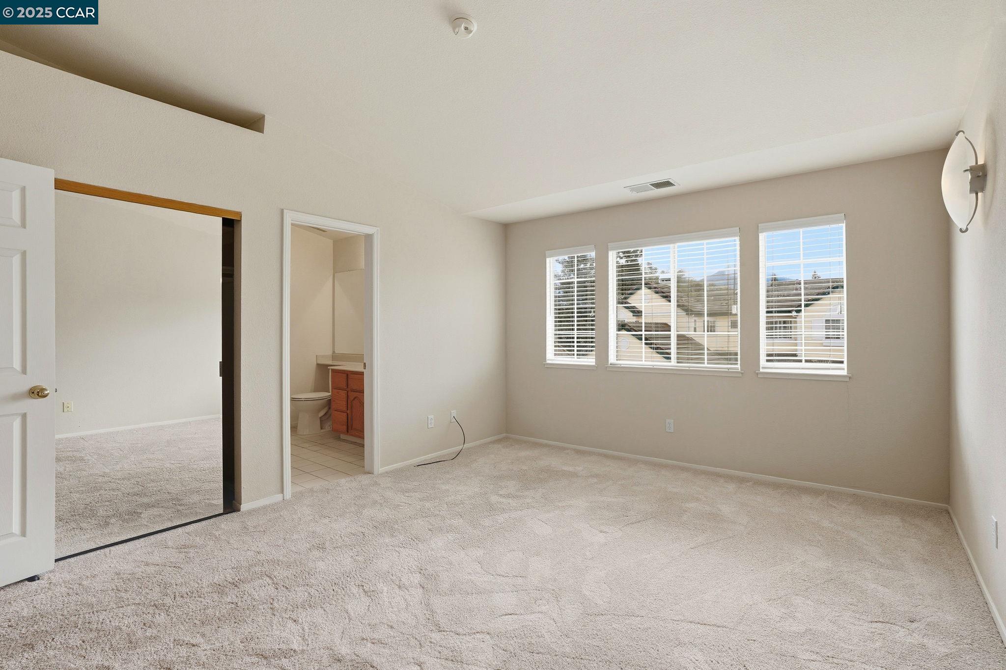 1295 Shell Circle Clayton, CA 94517 - Photo 26 of 36 an empty room with windows