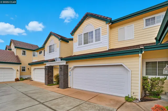 a front view of a house with a garage