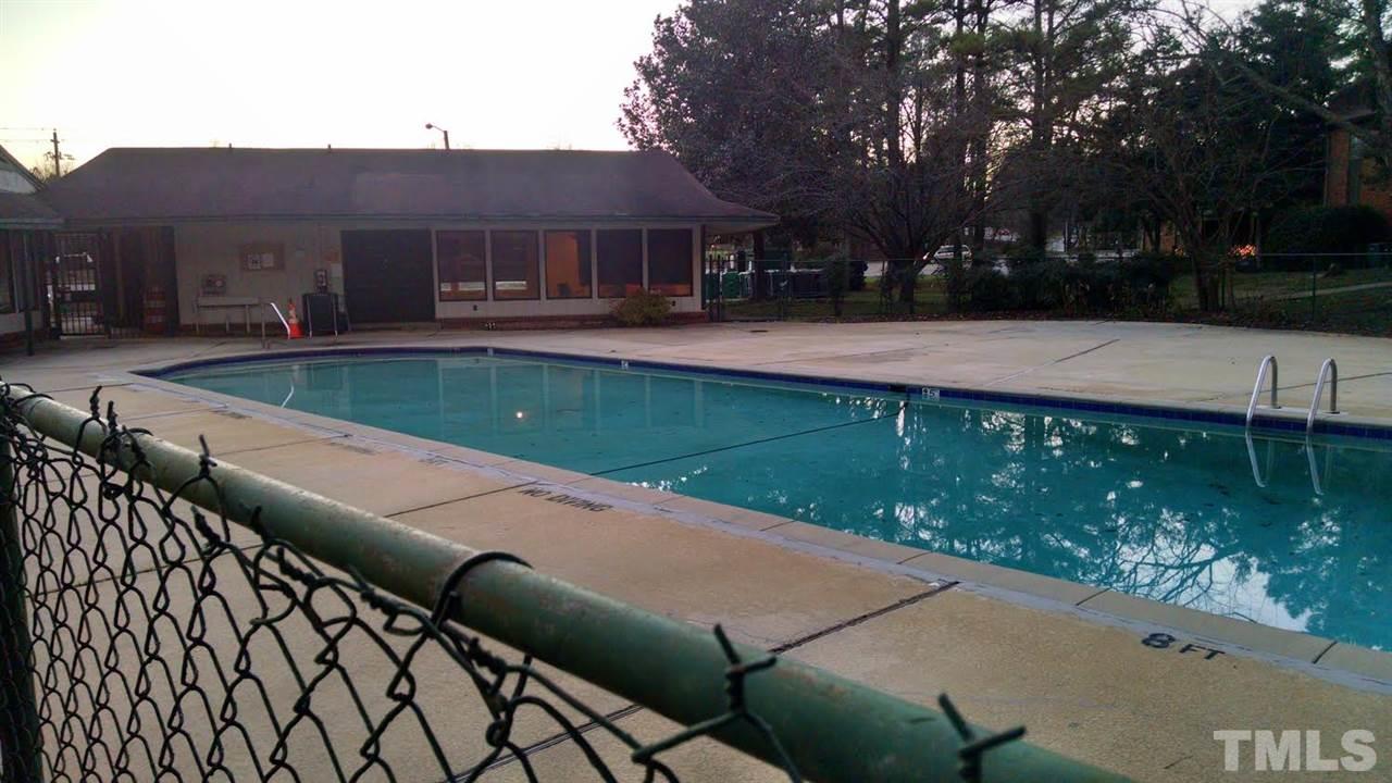 5808 Falls Of Neuse Road, Unit D Raleigh, NC 27609 - Photo 5 of 6 a view of a swimming pool with a patio