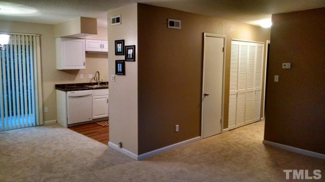 5808 Falls Of Neuse Road, Unit D Raleigh, NC 27609 - Photo 6 of 6 a kitchen with stainless steel appliances granite countertop a refrigerator and a stove top oven