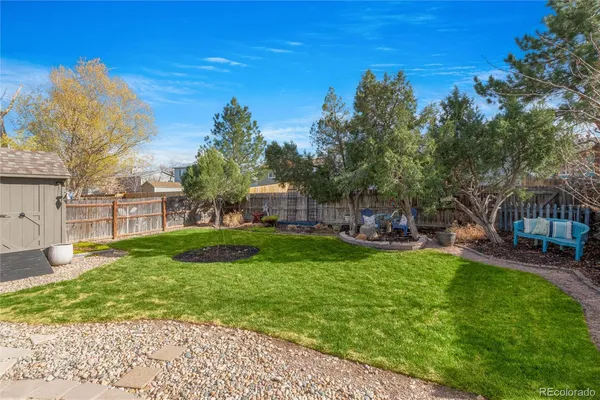 a bathroom with a sink a toilet a mirror a vanity and shower