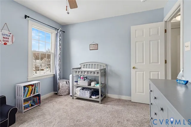 a bathroom with a granite countertop sink a toilet and a shower
