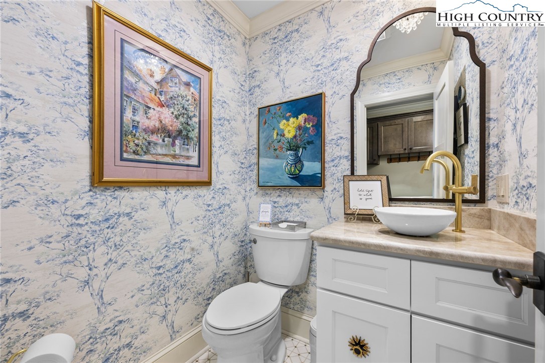 129 Valley View Road Blowing Rock, NC 28605 - Photo 15 of 45 a bathroom with a toilet sink and mirror