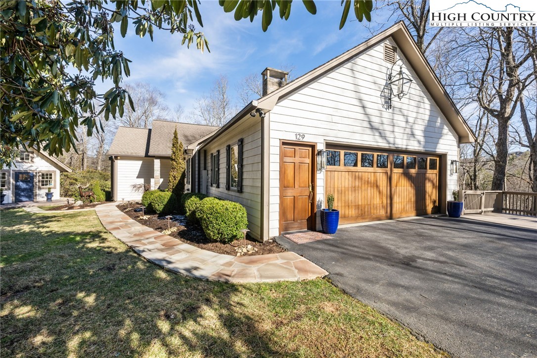 129 Valley View Road Blowing Rock, NC 28605 - Photo 2 of 45 a view of a house with a patio