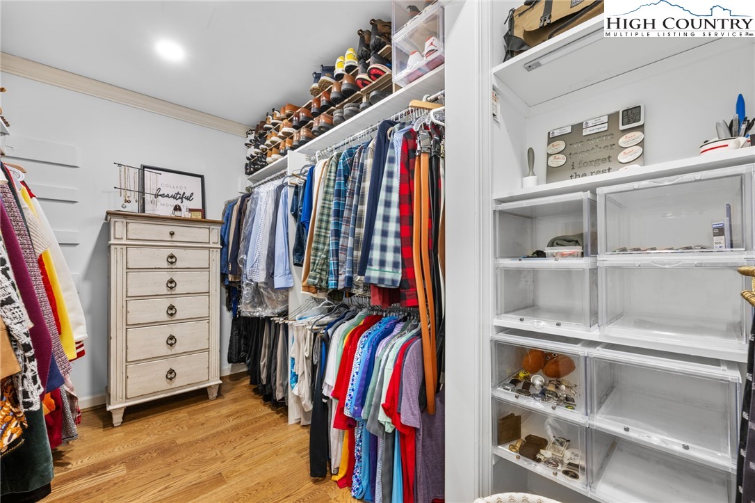129 Valley View Road Blowing Rock, NC 28605 - Photo 21 of 45 a view of walk in closet with clothes and shoes