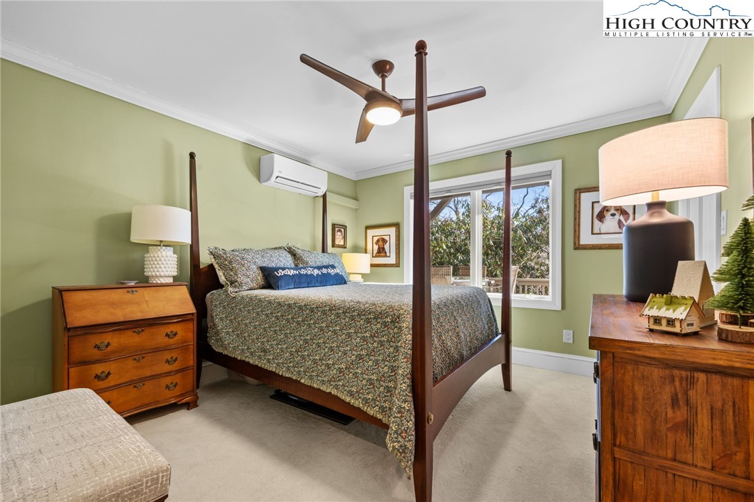 129 Valley View Road Blowing Rock, NC 28605 - Photo 27 of 45 a bed room with a bed window and a dresser