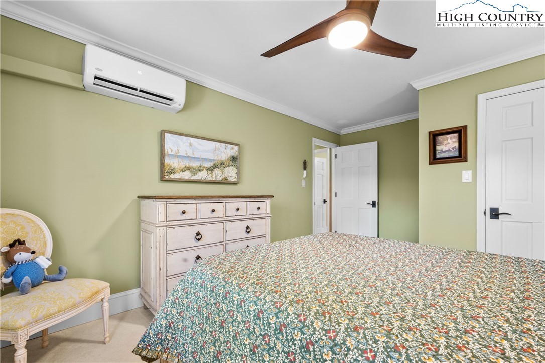 129 Valley View Road Blowing Rock, NC 28605 - Photo 28 of 45 a bedroom with a bed and a dresser in it