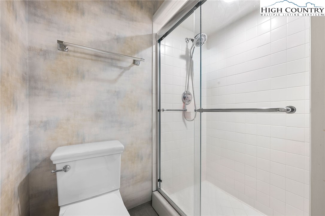 129 Valley View Road Blowing Rock, NC 28605 - Photo 31 of 45 a bathroom with a shower and toilet