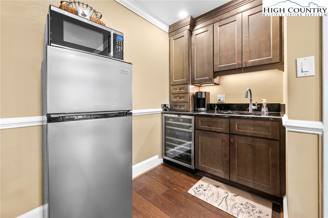 129 Valley View Road Blowing Rock, NC 28605 - Photo 33 of 45 a kitchen with stainless steel appliances granite countertop a refrigerator sink and cabinets