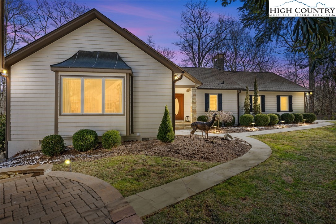 129 Valley View Road Blowing Rock, NC 28605 - Photo 45 of 45 a front view of a house with garden