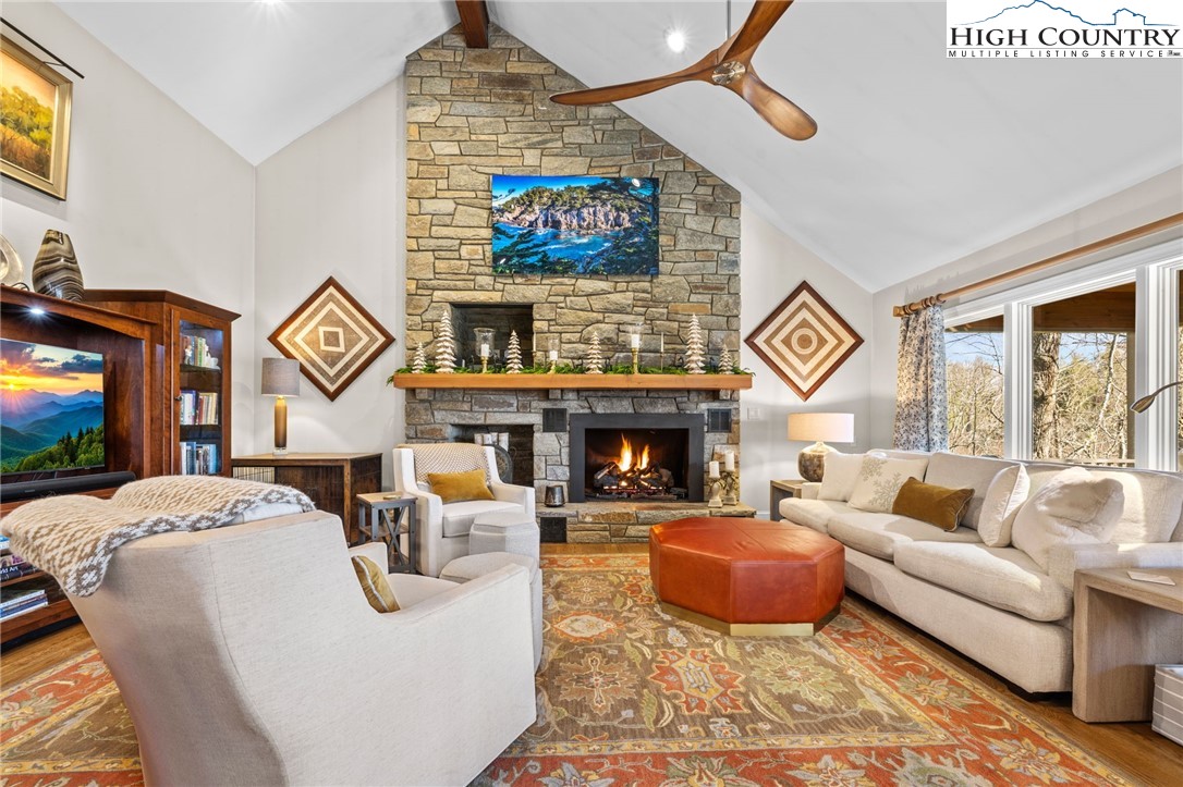 129 Valley View Road Blowing Rock, NC 28605 - Photo 5 of 45 a living room with fireplace furniture and a flat screen tv