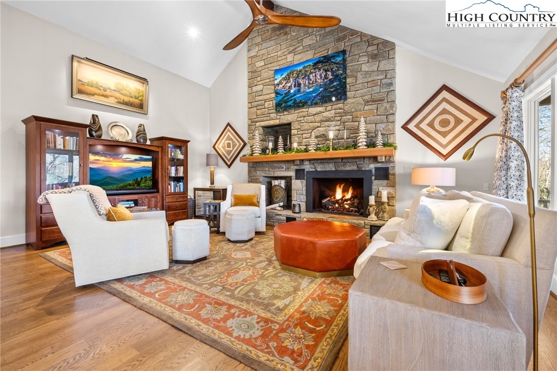 129 Valley View Road Blowing Rock, NC 28605 - Photo 6 of 45 a living room with furniture and a fireplace