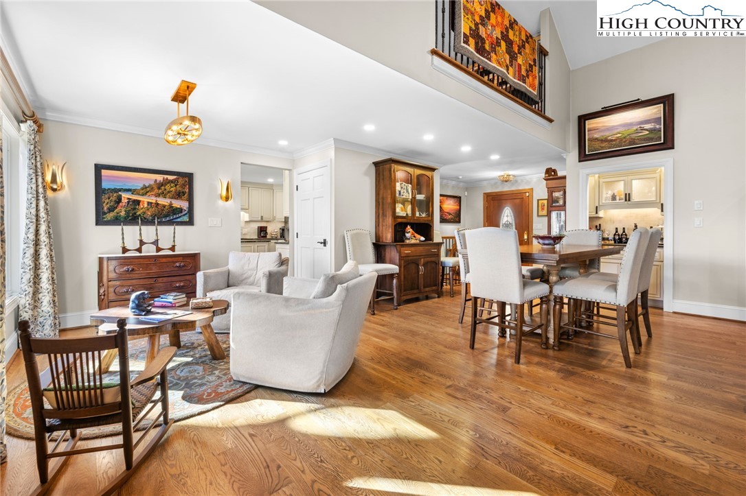 129 Valley View Road Blowing Rock, NC 28605 - Photo 7 of 45 a living room with furniture a flat screen tv and a dining table