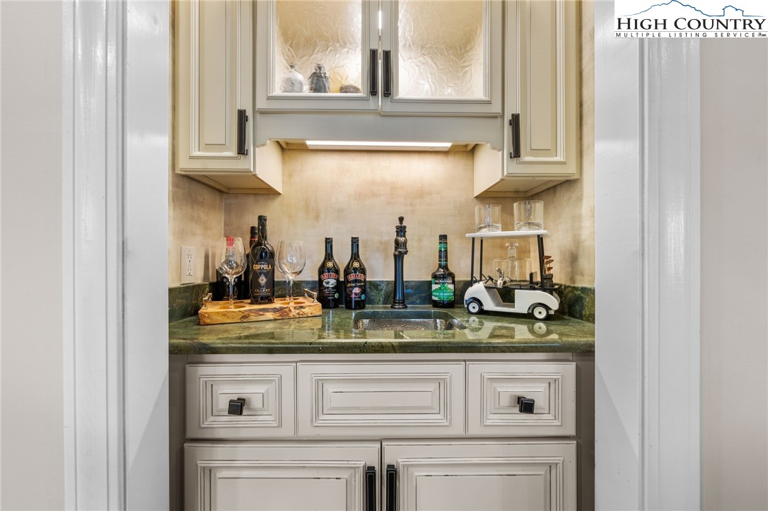 129 Valley View Road Blowing Rock, NC 28605 - Photo 9 of 45 a sink with a mirror