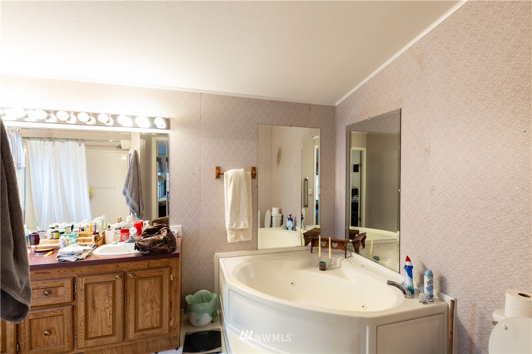 35909 Old Sultan-Startup Road Sultan, WA 98294 - Photo 12 of 22 a bathroom with a sink and a mirror