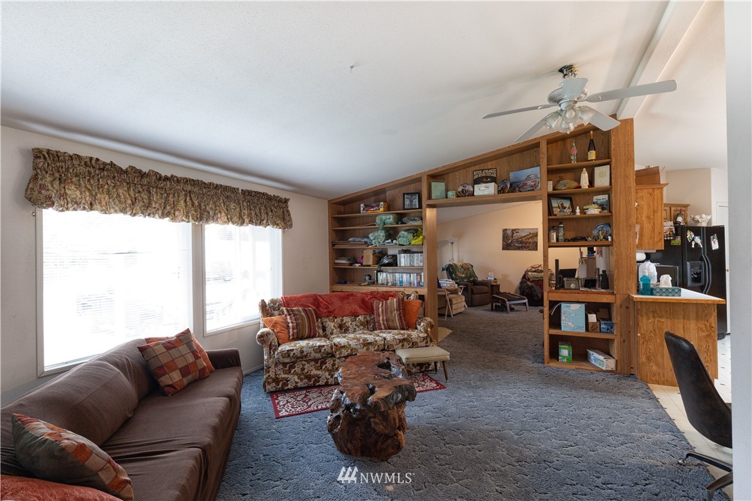 35909 Old Sultan-Startup Road Sultan, WA 98294 - Photo 5 of 22 a living room with furniture a fireplace and a large window