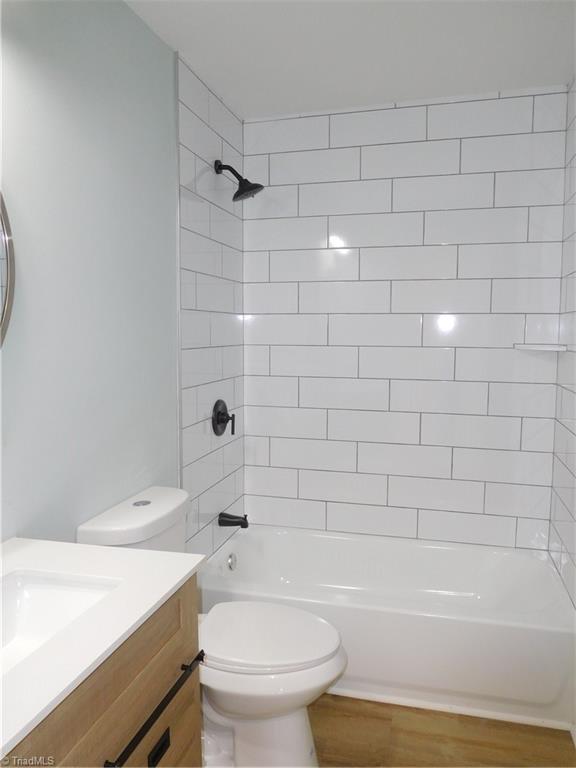 1025 Motor Road Winston-Salem, NC 27105 - Photo 20 of 33 MAIN LEVEL HALLWAY BEDROOM COMPLETE WITH NEW FIXTURES & TILE SURROUND FOR TUB/SHOWER