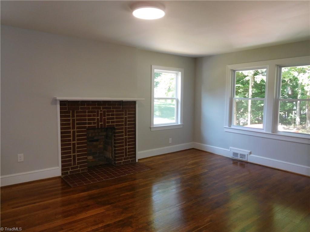 1025 Motor Road Winston-Salem, NC 27105 - Photo 5 of 33 FIREPLACE IN LIVING ROOM. SELLER HAS NO KNOWLEDGE OF IT.
