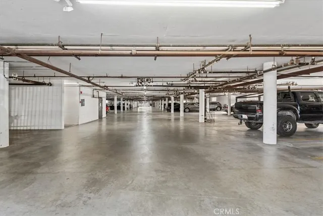 a view of a water heater room with a garage