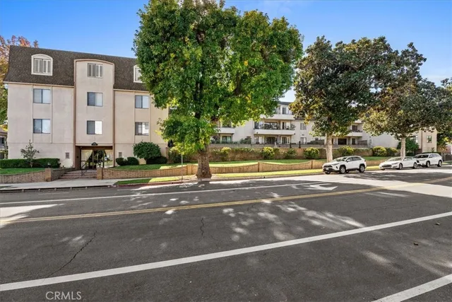 a view of street with parked cars