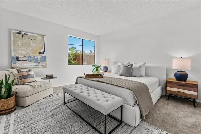 a bedroom with a bed and a couch