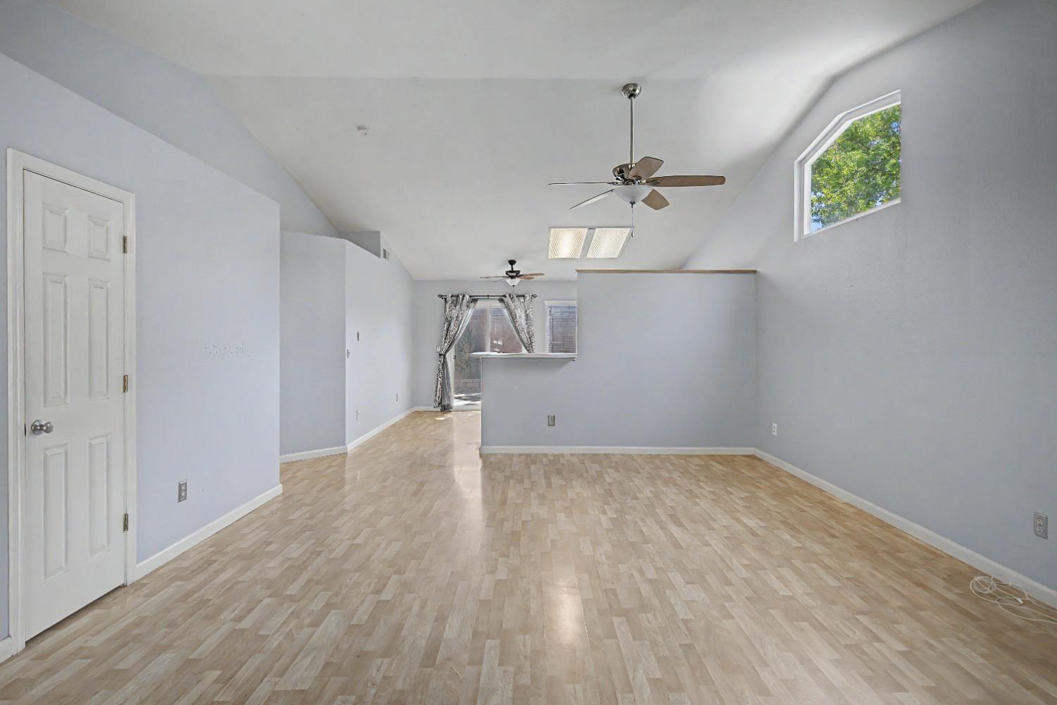 204 Gelf Lane Modesto, CA 95357 - Photo 5 of 29 Living room and kitchen in distance.