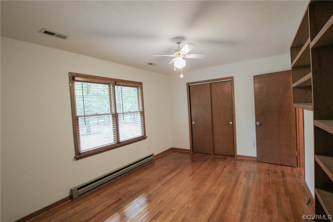 1120 Mill Road King William, VA 23086 - Photo 22 of 40 a view of an empty room with wooden floor and a window