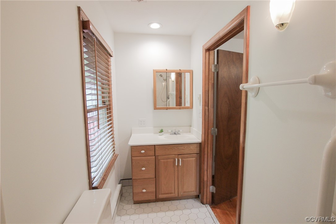 1120 Mill Road King William, VA 23086 - Photo 27 of 40 a bathroom with a sink a toilet and mirror