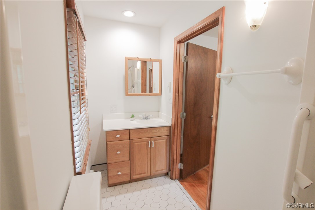 1120 Mill Road King William, VA 23086 - Photo 28 of 40 a bathroom with a sink a mirror and a shower