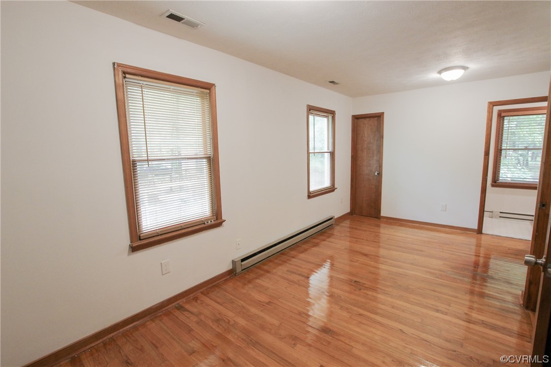 1120 Mill Road King William, VA 23086 - Photo 30 of 40 an empty room with wooden floor and windows