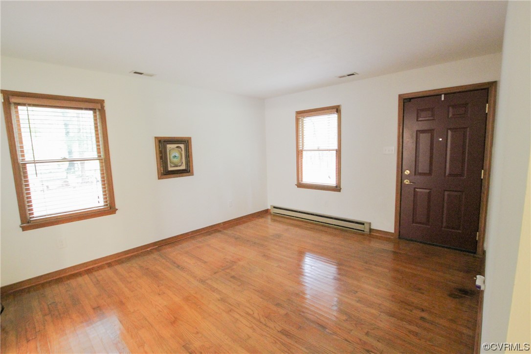 1120 Mill Road King William, VA 23086 - Photo 3 of 40 a view of an empty room with wooden floor and a window