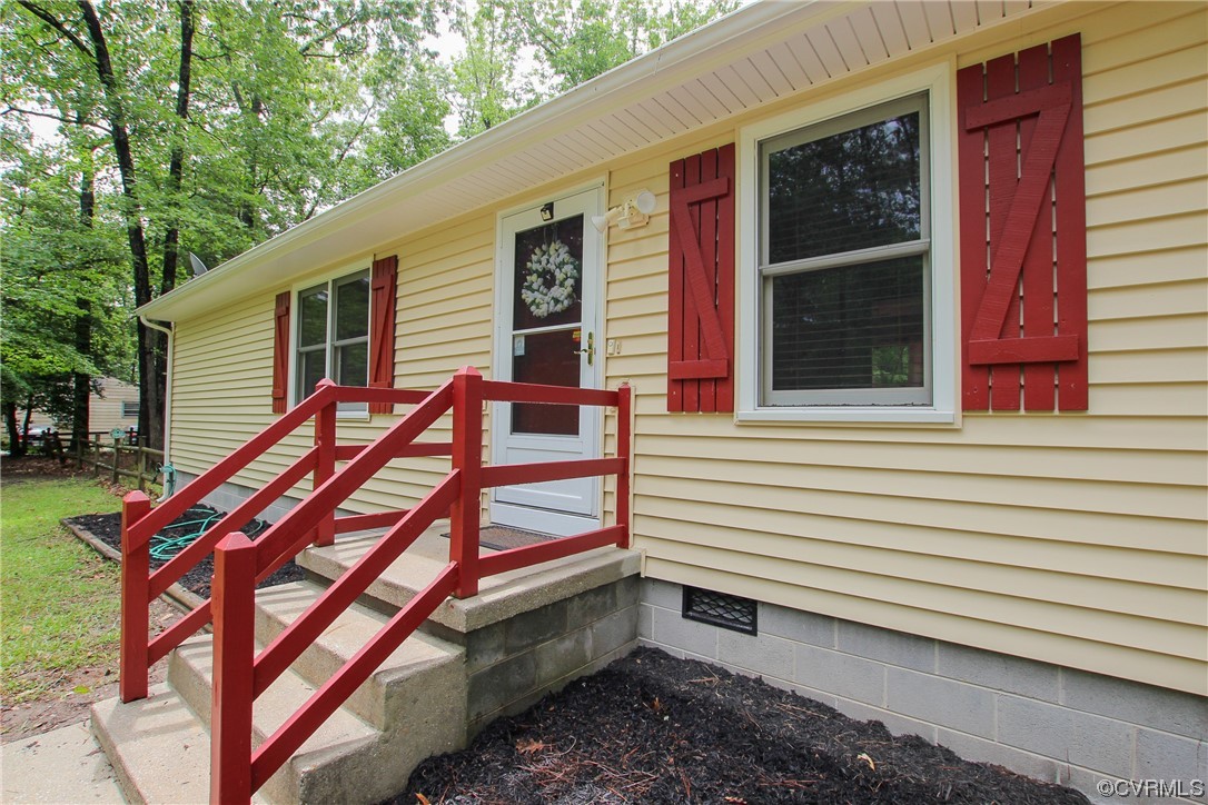 1120 Mill Road King William, VA 23086 - Photo 32 of 40 a backyard of a house with a barbeque and wooden floor and fence