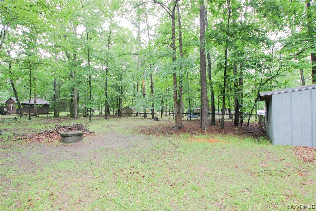 1120 Mill Road King William, VA 23086 - Photo 37 of 40 a backyard of a house with yard and trampoline