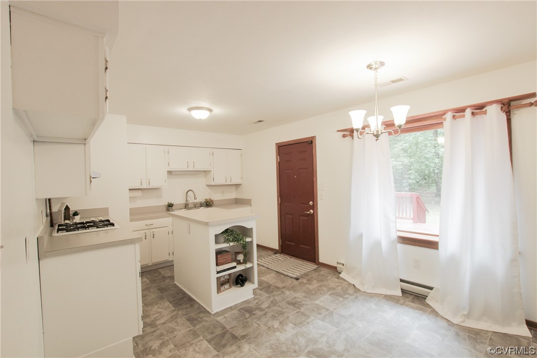 1120 Mill Road King William, VA 23086 - Photo 5 of 40 a kitchen that has a lot of cabinets a sink and appliances in it