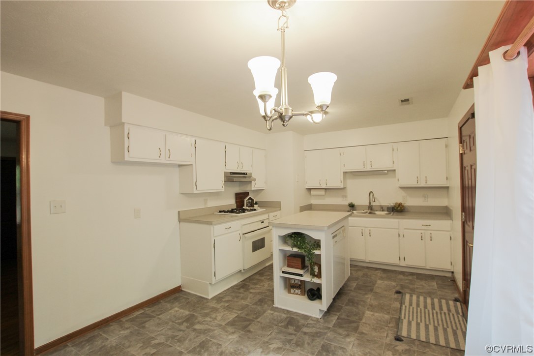 1120 Mill Road King William, VA 23086 - Photo 6 of 40 a kitchen with stainless steel appliances granite countertop a sink a stove a refrigerator and white cabinets