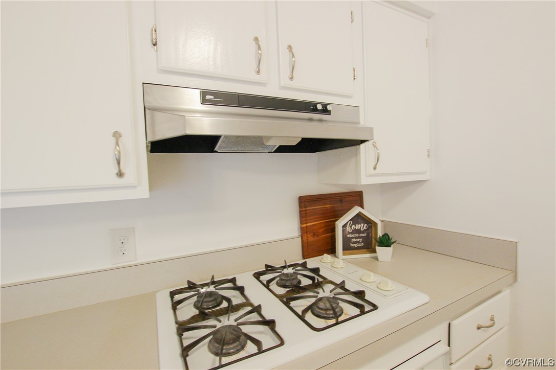 1120 Mill Road King William, VA 23086 - Photo 9 of 40 a kitchen with a stove and a white cabinets