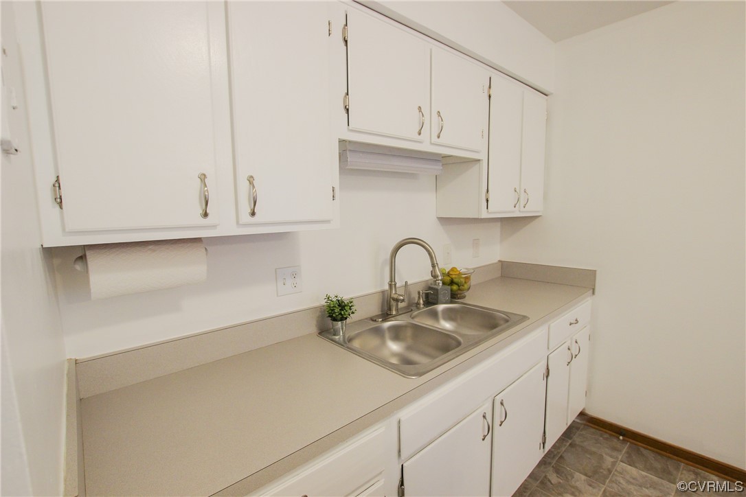 1120 Mill Road King William, VA 23086 - Photo 10 of 40 a kitchen with white cabinets and a sink