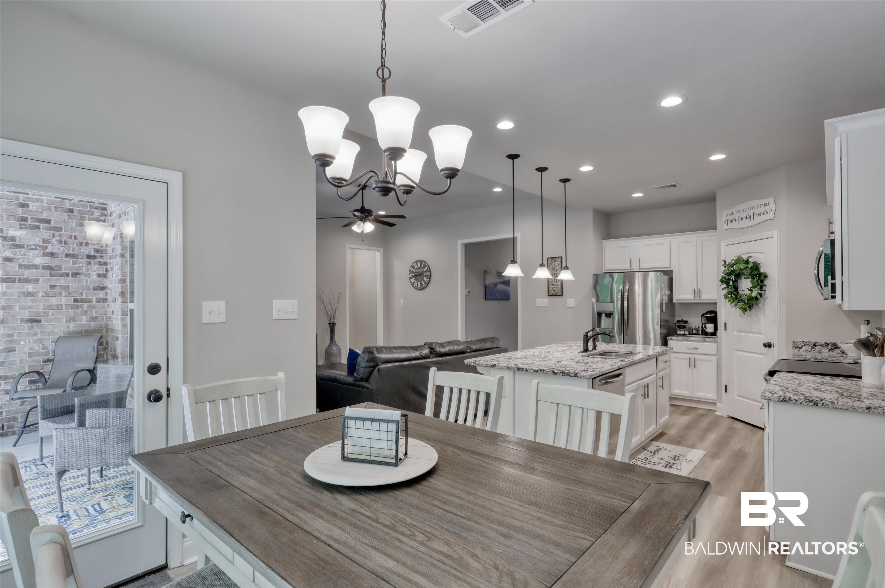 987 Gibson Court Foley, AL 36535 - Photo 12 of 34 Dining room featuring visible vents, recessed lighting, light wood-style flooring, and ceiling fan with notable chandelier