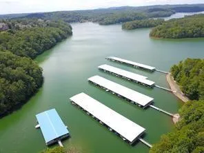 an aerial view of a house with a lake view